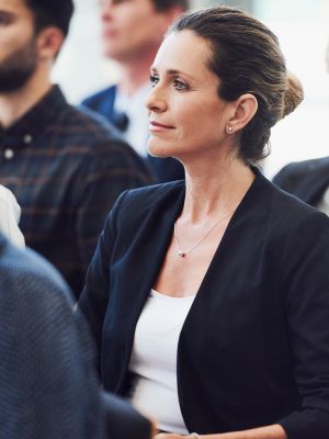 young professional woman attending a seminar